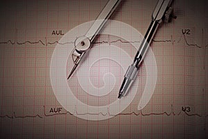 EKG printout and compasses photo