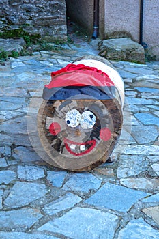 El caga tiÃÂ³ or el tiÃÂ³ de nadal. El TiÃÂ³ de Mura. Catalan Christmas tradition consisting of asking for gifts from a wooden log. photo