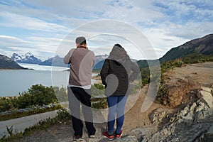Tourists taking pictures of Perito Moreno Glacier view from Mirador de los Suspiros in the Los Glaciares National Park