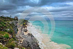 El Castillo beach with dramatic sky and turquoise pristine water in Tulum, Yucatan peninsula Mexico