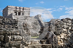 El Castillo Maya ruins behind blurred wall, Tulum, Mexico