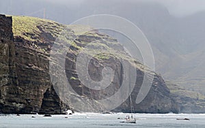 El Dedo de Dios - rock near the coast bay near the town Agaete in the island of Gran Canaria photo