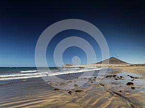 El medano beach and montana roja landscape in tenerife spain photo