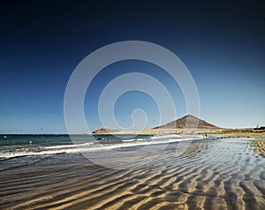 El medano beach and montana roja landscape in tenerife spain photo