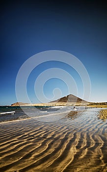 El medano beach and montana roja in south tenerife spain photo