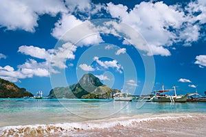 El Nido bay with boats on the beach and Cadlao island, Palawan, Philippines