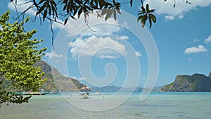 El Nido bay. Palawan, Philippines. View to lagoon with Bangka banca boats floating in shallow blue water