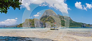 El Nido bay with trip boat and Cadlao island, Palawan, Philippines. Panoramic view