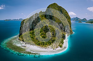 El Nido, Palawan, Philippines. Aerial drone above shot of impressive Pinagbuyutan Island. Amazing white sand Ipil beach