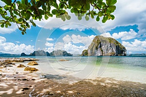 El Nido, Palawan, Philippines. Leaves framed picture of Pinagbuyutan island and beautiful tropical coastline seascape