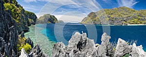 El Nido, Palawan, Philippines. Panorama of tapiutan strait with tourist boats on tour C. View from Matinloc island