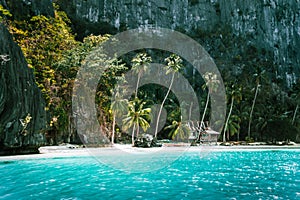 El Nido, Palawan, Philippines. Secluded tropical hut on Pinagbuyutan Island. Amazing white sand beach,turquoise blue