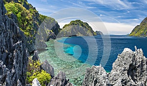 El Nido, Palawan, Philippines. Tapiutan strait with tourist boats. View from Matinloc island located in Bacuit Archipelago