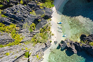 El Nido, Palawan, Philippines, top down bird eye aerial view of boats and cliffs rocky mountains scenery at Secret