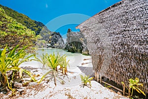 El Nido, Palawan, Philippines. Unknown star beach with overnight accommodations. Beautiful shallow ocean lagoon and