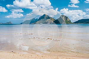 El Nido, Palawan,Philippines. Yacht boat in lagoon of Las Cabanas Beach with amazing mountains in background