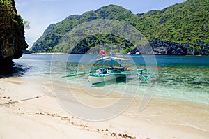 El Nido, Philippines - banca on the beach, Tapiutan island photo