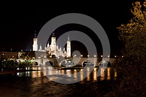 El Pilar cathedral in Zaragoza with the stone bridge