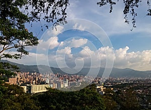 El Poblado, Medellin, Colombia. Great mountains, sky and skyscrapers of the city photo