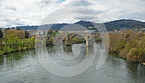 Puente medieval Puente romano sobre el rio MiÃÂ±o en Ourense Orense, Galicia, EspaÃÂ±a photo