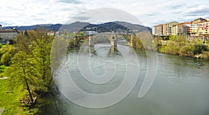 Puente medieval Puente romano sobre el rio MiÃÂ±o en Ourense Orense, Galicia, EspaÃÂ±a photo