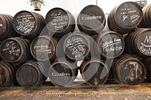 El Puerto de Santa Maria, Cadiz, Spain - June 15, 2021:  Exposure of barrels of Caballero in The San Marcos castle. In Wineries photo