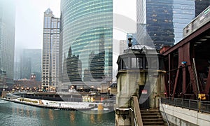 El train speeds over the Chicago River on a foggy morning in January.