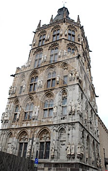 Elaborate historic tower with many statues in Cologne in Germany