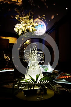 Elaborate ice sculpture at a wedding reception