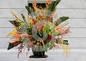 Elaborate vase filled with exotic flower arrangement