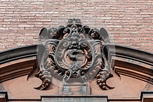 Elaborately carved stone entry pediment, architectural ornament