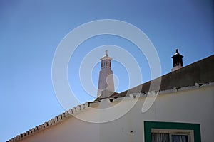 Elaborately crafted chimney on a roof in Portugal photo