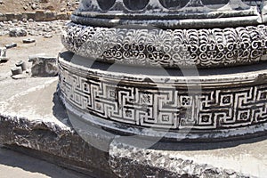 Elaborately decorated bases of the massive columns