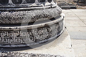 Elaborately decorated bases of the massive columns