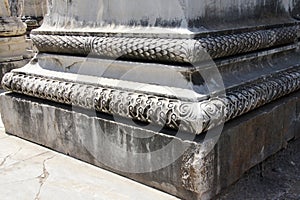 Elaborately decorated bases of the massive columns of the Apoll