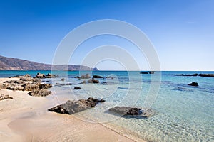 Elafonisi beach in Crete, Greece. Crystal clear sea water and blue sky