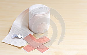 Elastic adhesive bandage and adhesive plaster as first aid to tr