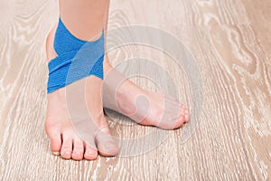 Elastic bandage on the ankle of the leg. Joint fixation concept with a bandage, copy space for text