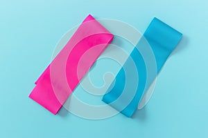 Elastic expanders on blue background view from above, copy space