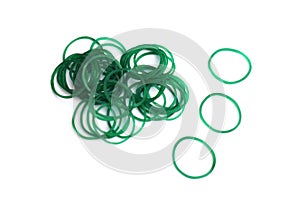 Elastic green rubber bands in ring or oval shape on white background