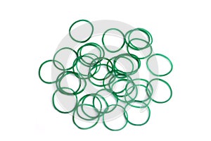 Elastic green rubber bands in ring or oval shape on white background.