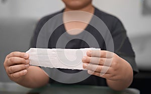 Elastic roll gauze bandage hold in hand with adhesive for first aid compress care for accident with release