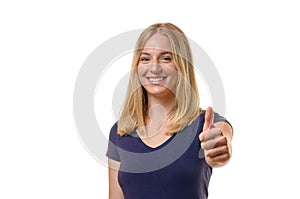 Elated young woman giving a thumbs up