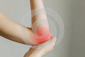 Elbow injury and fatigue at work. Damage zone, image on an empty background