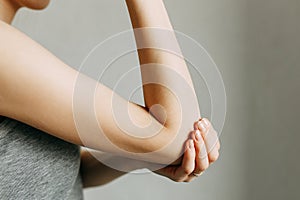 Elbow injury and fatigue at work. Damage zone, image on an empty background.