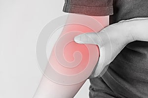 Elbow injury in humans .elbow pain,joint pains people medical, mono tone highlight at elbow