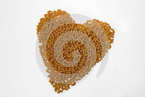 Elbow macaroni pasta in the shape of a heart