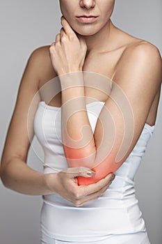 Elbow Pain. Closeup Beautiful Female Body With Pain In Arms