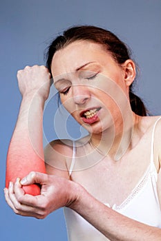 Elbow pain woman illness tennis correct posture red spot