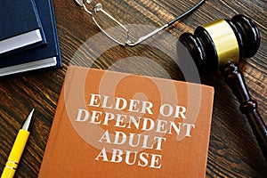 Elder or dependent adult abuse book and gavel.